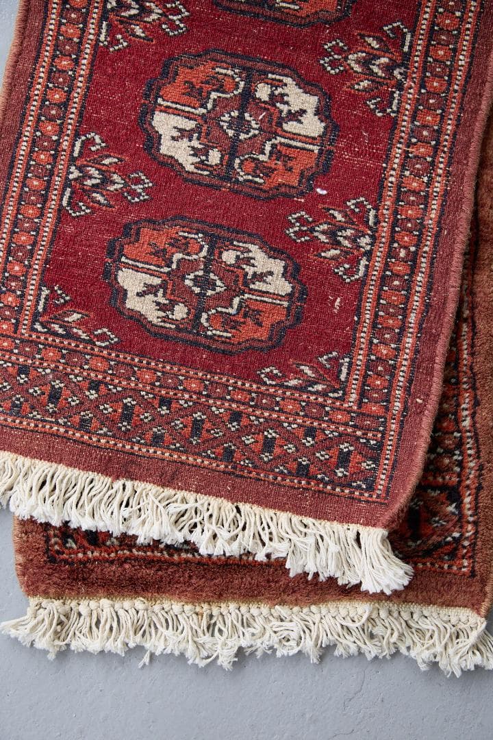 ヴィンテージラグ　トライバルラグ　パキスタン（95×33cm）赤　茶　オレンジ