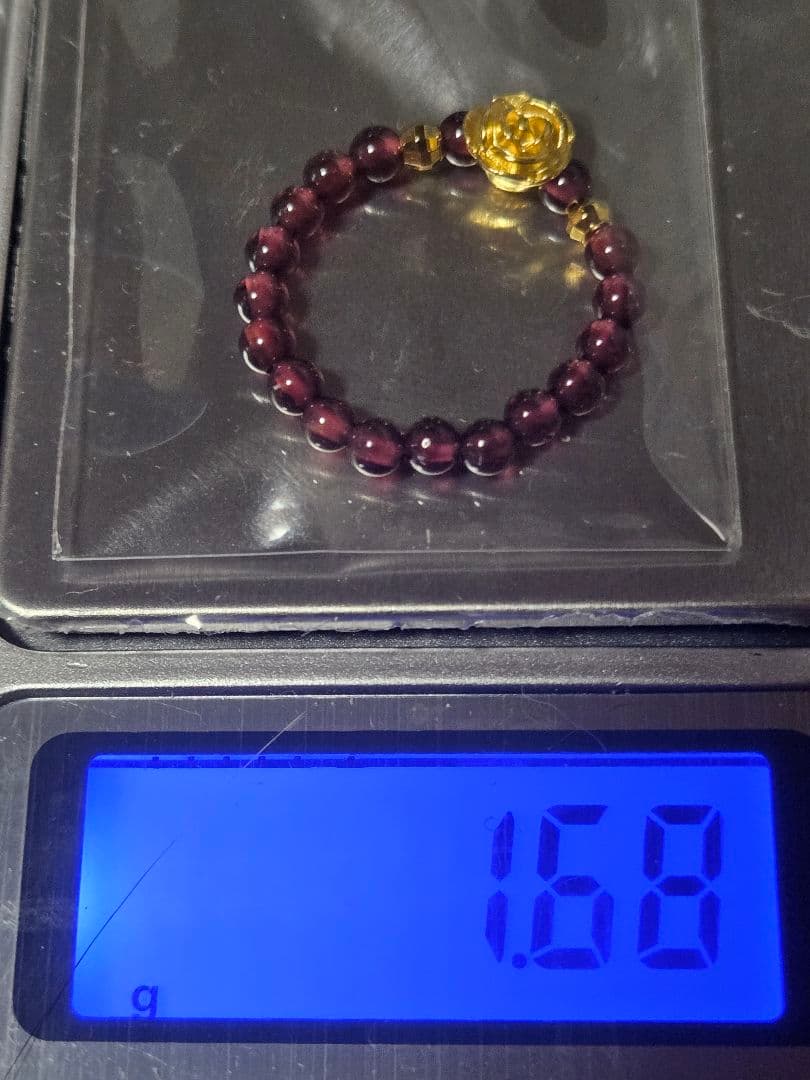 ピカピカ24金の花と天然石？のリング 金部分は鑑定済、純金保証します