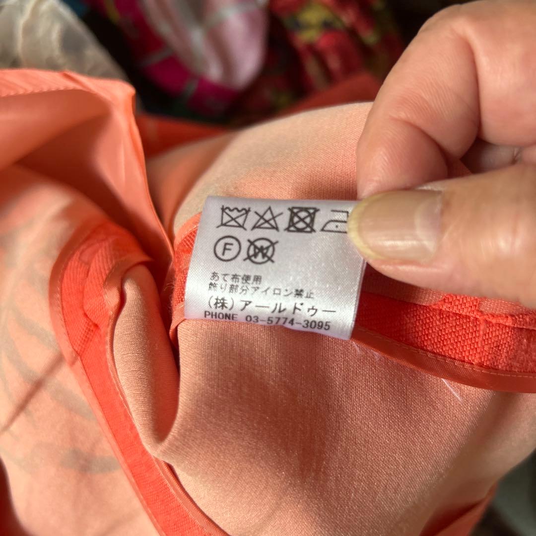 透かし織りの豪華なアンサンブルスーツ　オレンジ系