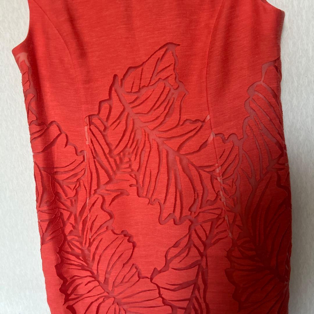 透かし織りの豪華なアンサンブルスーツ　オレンジ系