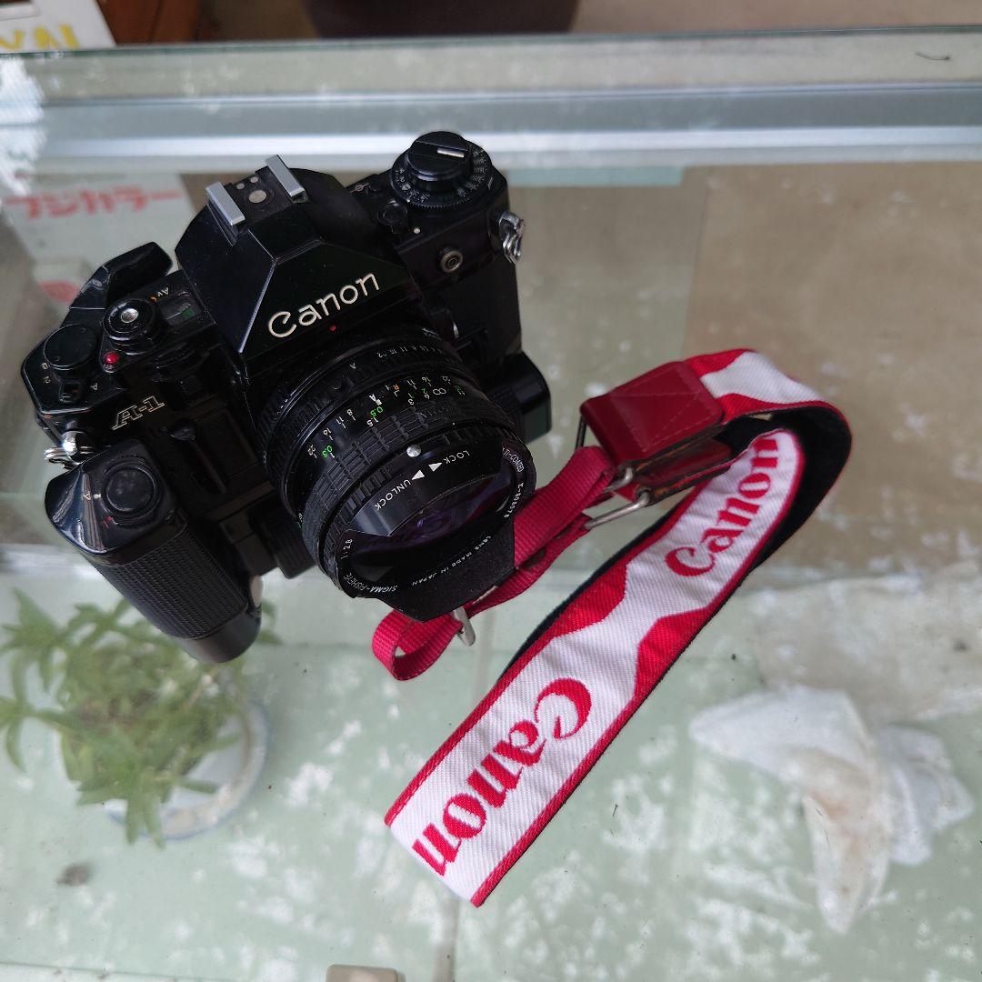 CanonA-1 フィルムカメラ　モータードライブ　シグマ16mmレンズ付き