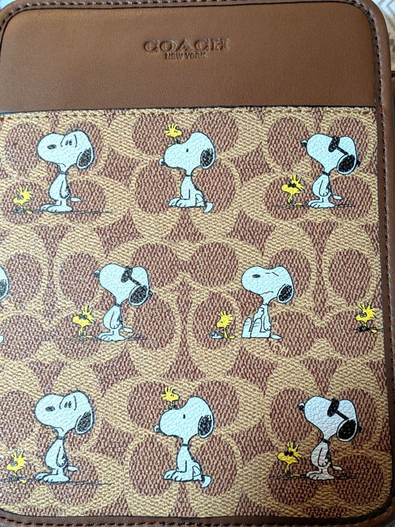 サリバン クロスボディ バッグ・シグネチャー キャンバス・スヌーピー プリント