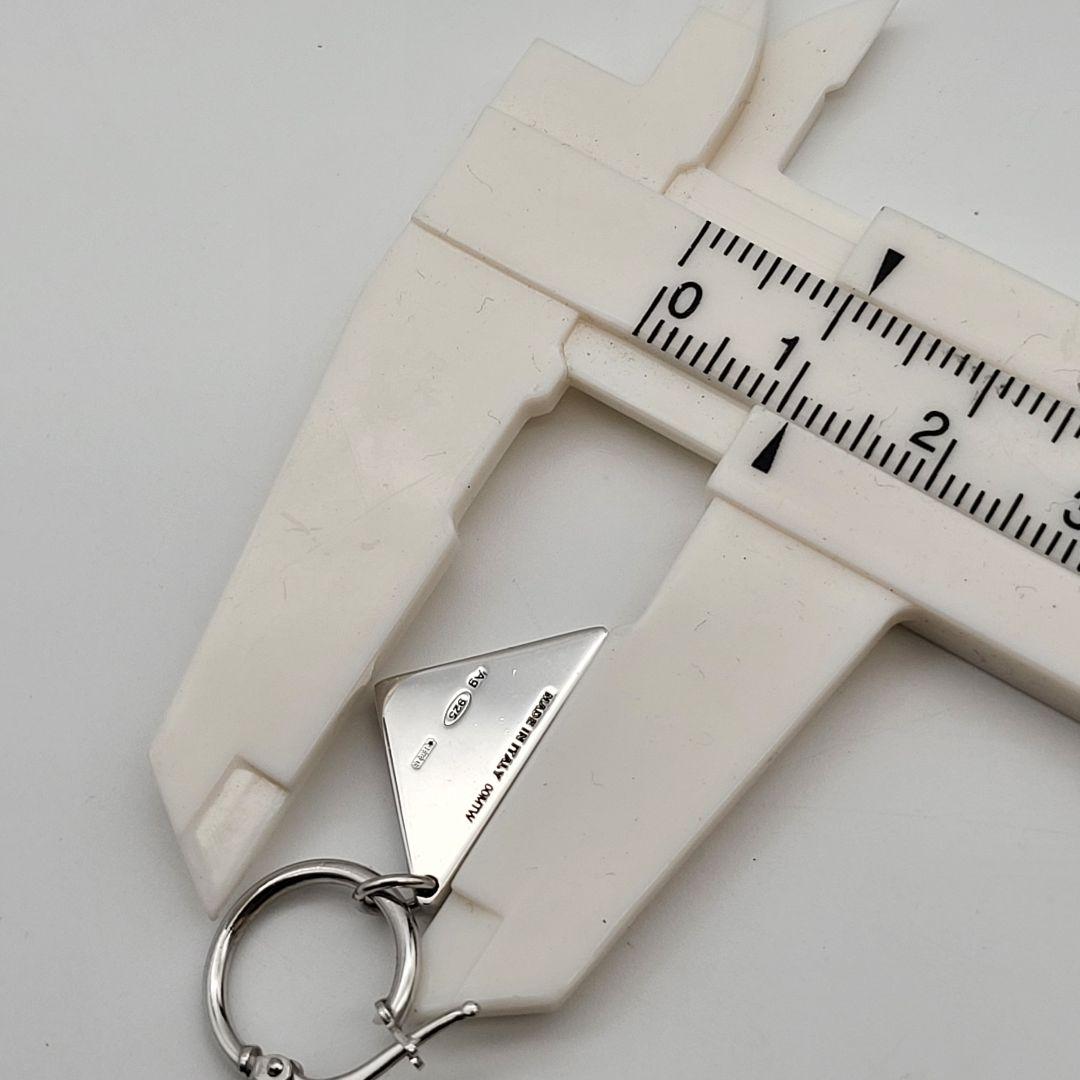 PRADA シルバー 三角形ピアス(片耳用) クリスタルロゴ ジュエル