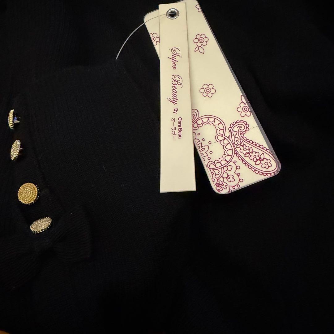 スーパービューティー新品未使用タートルネック袖口がリボン飾りでチャーミング