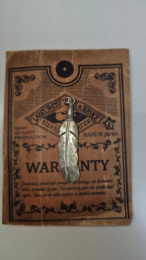 LARRY SMITHシルバー イーグルフェザー