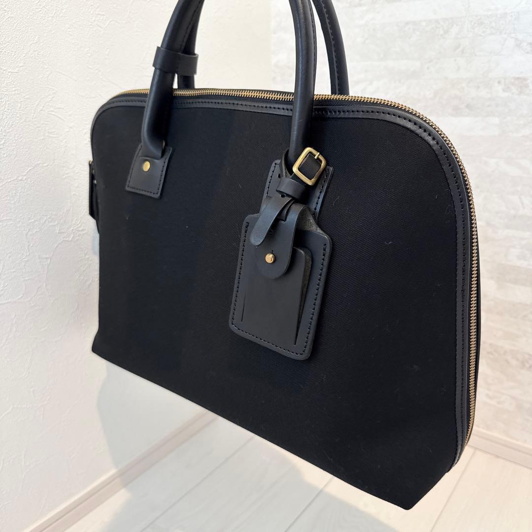 SLOW　TRADITIONAL コットンサージ/ラウンドブリーフケース