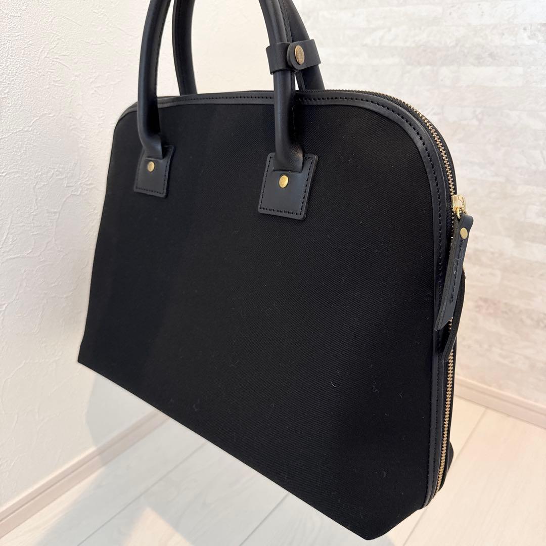 SLOW　TRADITIONAL コットンサージ/ラウンドブリーフケース