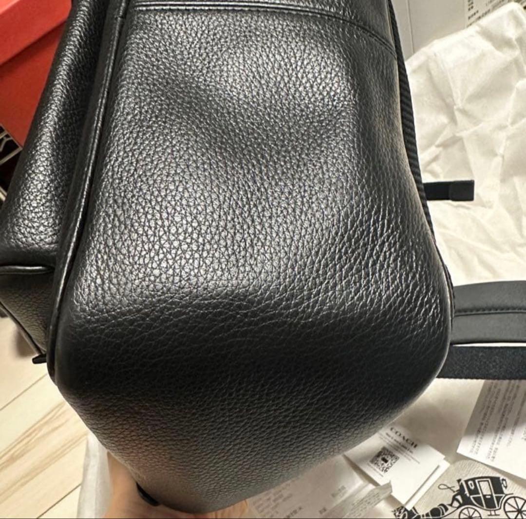 バッグ COACH PEBBLED LEATHER COURT BACKPACK