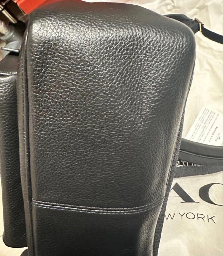 バッグ COACH PEBBLED LEATHER COURT BACKPACK
