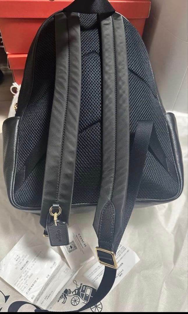 バッグ COACH PEBBLED LEATHER COURT BACKPACK