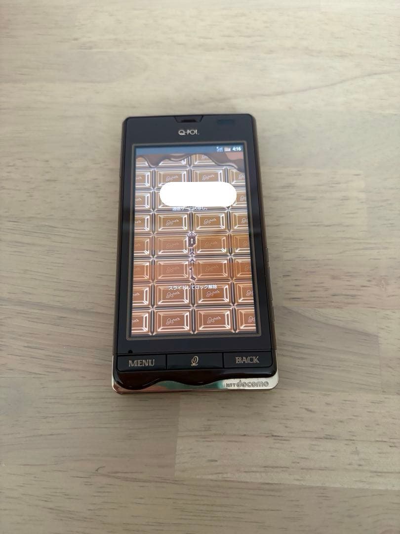 Q-pot.スマートフォン　チョコレート　ジャンク品