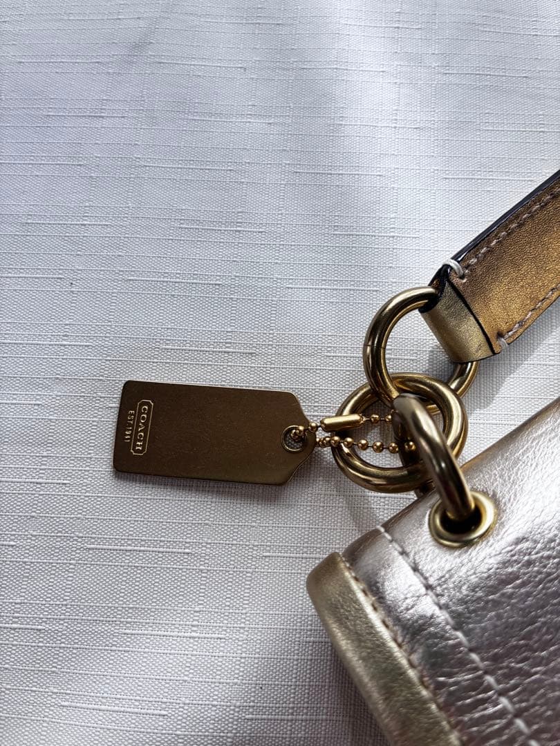 バッグ Coach legacy stripe turn lock llic