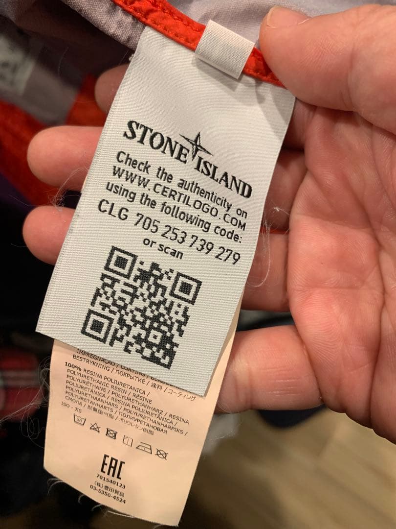 オレンジ フード付きジャケット